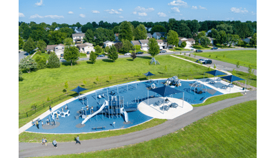 Elevated view of a large inclusive school playground play area.