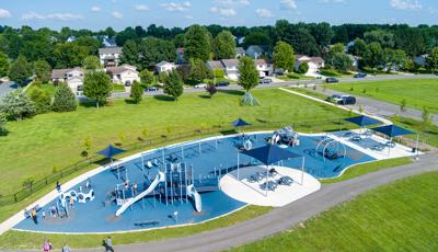 Elevated view of a large inclusive school playground play area.