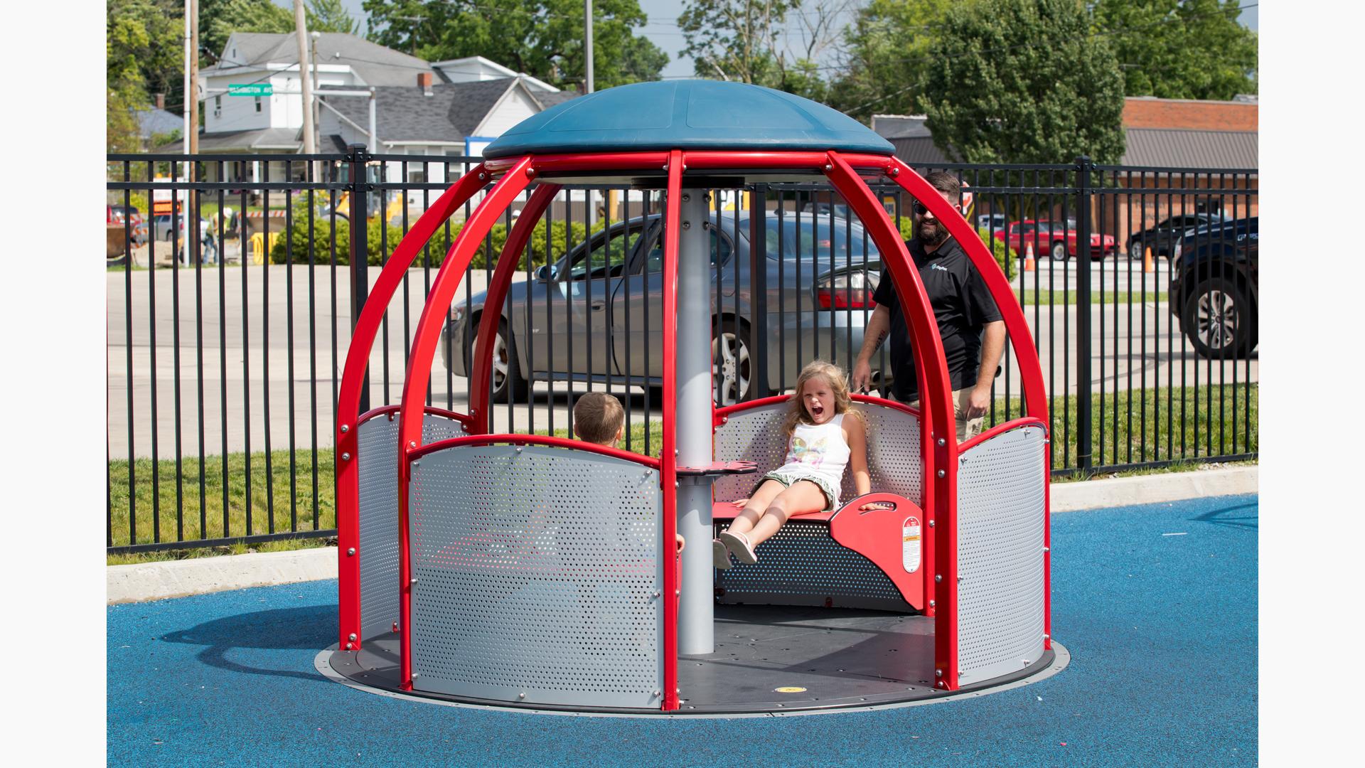 Children riding we-go-round