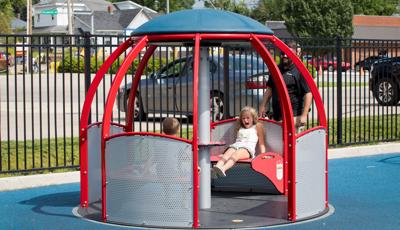 Children riding we-go-round