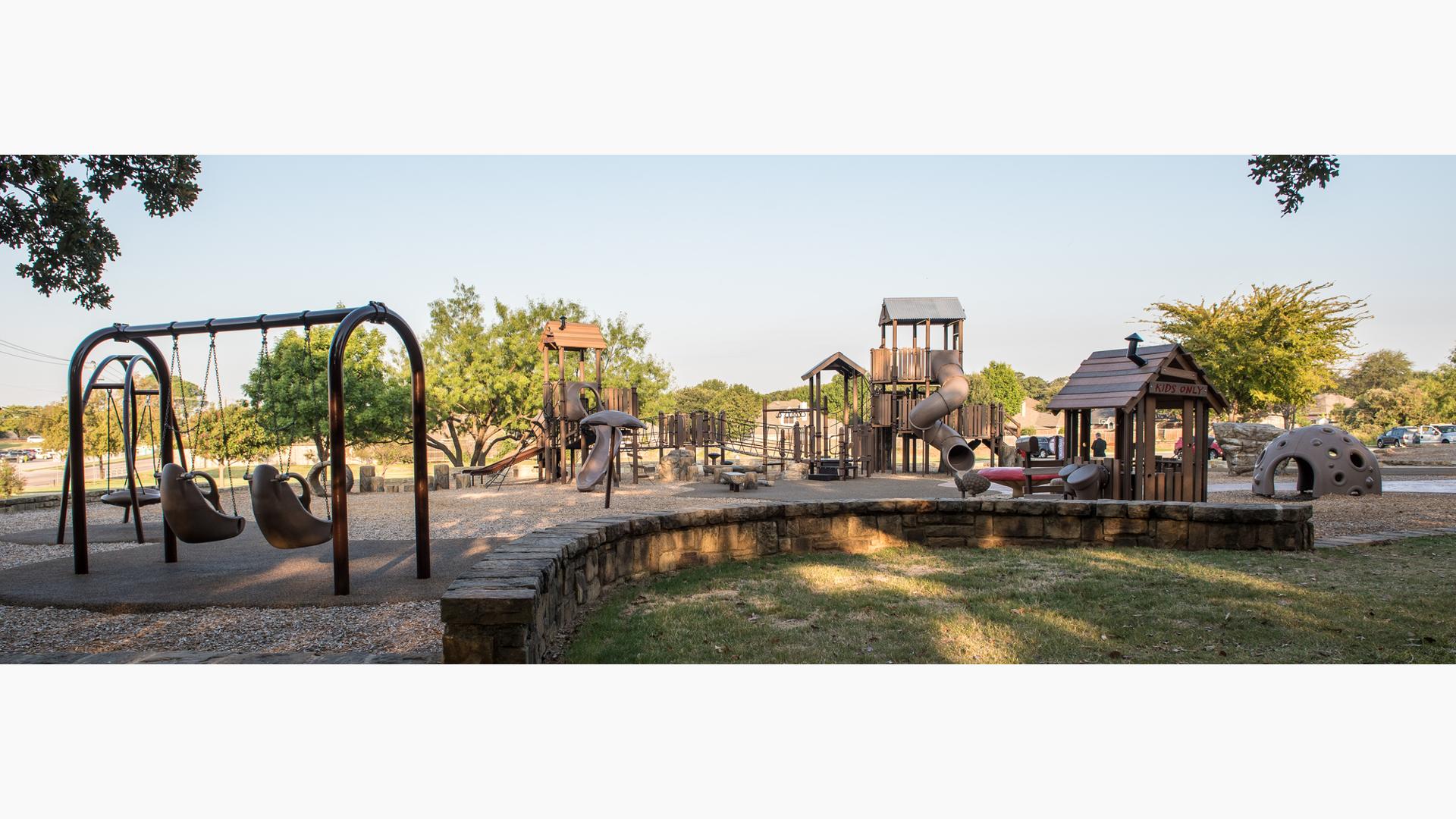 Brown colored, nature-inspired playground equipment.