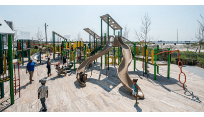 Beach 30th Street Playground Rockaway, NY. This customized PlayBooster® play structure features lots of playground slides like the Stainless Steel Spiral Slide, spinners, bridges, and many playground climbers.