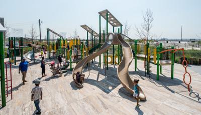 Beach 30th Street Playground Rockaway, NY. This customized PlayBooster® play structure features lots of playground slides like the Stainless Steel Spiral Slide, spinners, bridges, and many playground climbers.