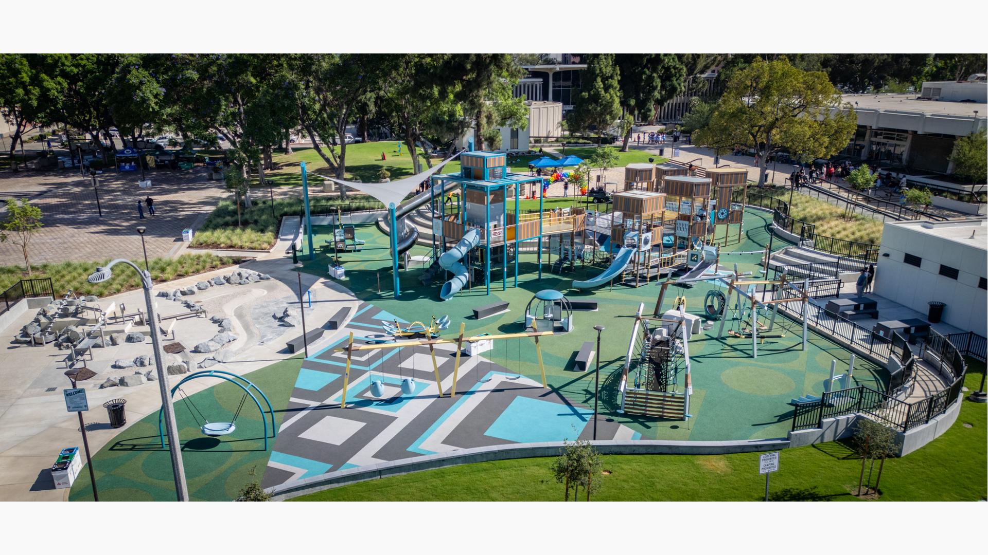 Elevated view of a custom park playground with blue and grey accents.