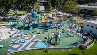 Elevated view of a custom park playground with blue and grey accents.