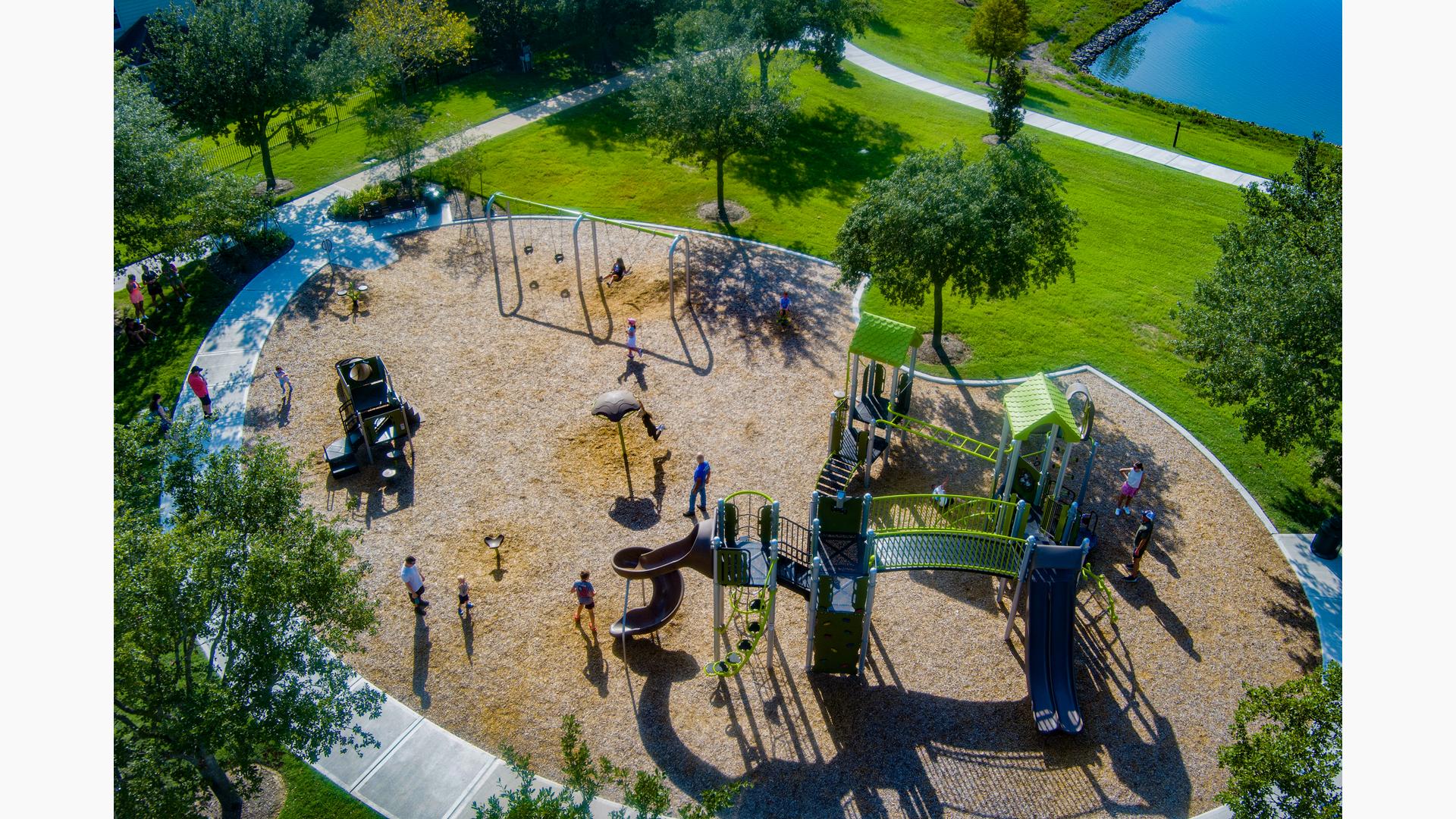 Elevated view of a park playground with playing children.