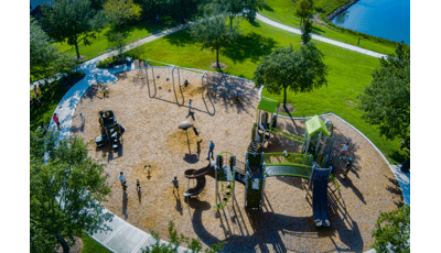 Elevated view of a park playground with playing children.