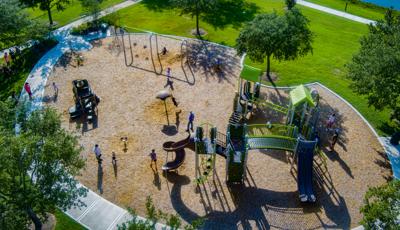 Elevated view of a park playground with playing children.