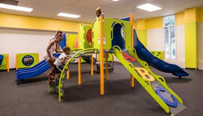 Orland Park Recreation Center, Orland Park, IL featuring a PlayShaper® play structure with a variety of playground climbers like the ABC Climber and slides like the SlideWinder2®.