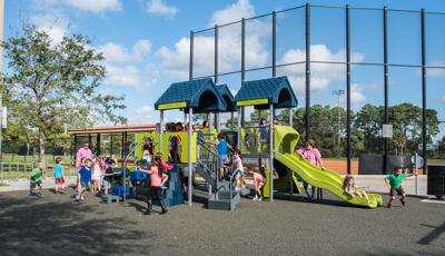 Mirasol Park, in Palm Beach Gardens, FL is a PlayShaper® playstructure featuring Wood Plank Wiggle Ladder,  and ABC Climber.