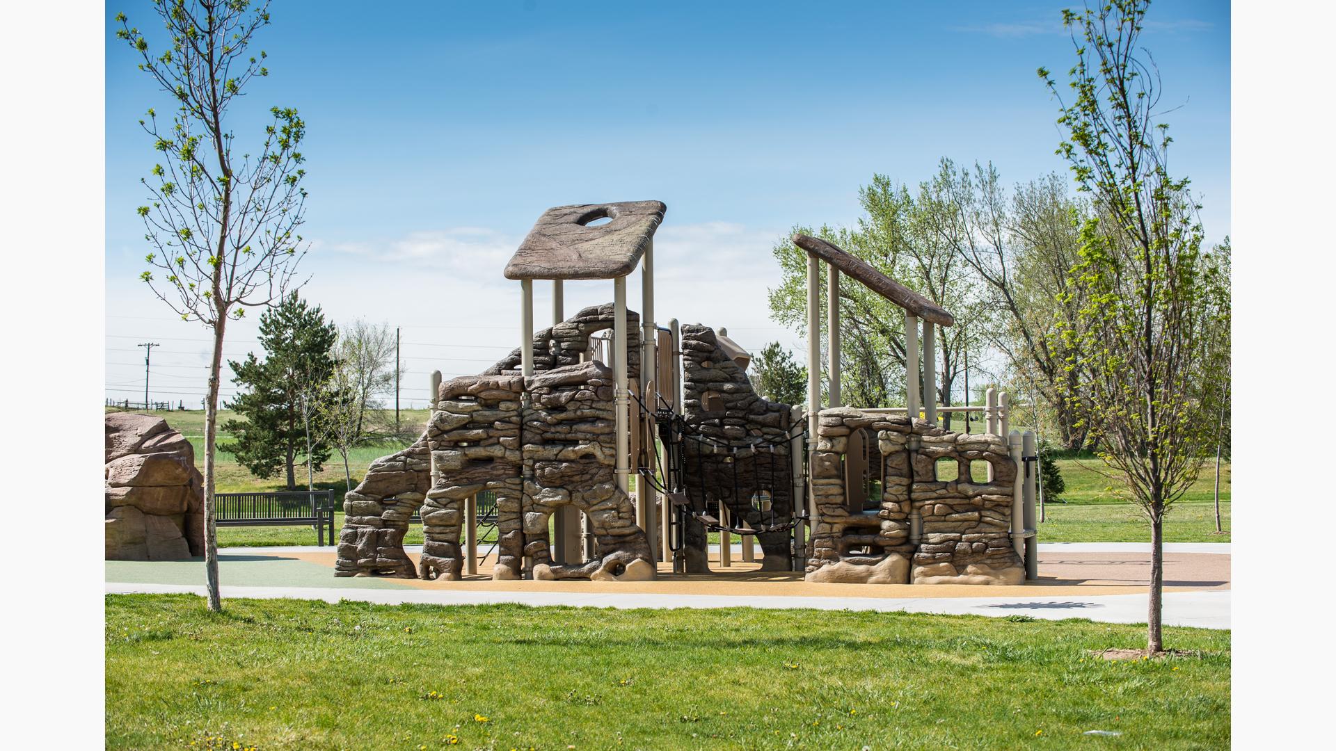 Custom nature-themed play structure that blends in perfectly with the natural surroundings.