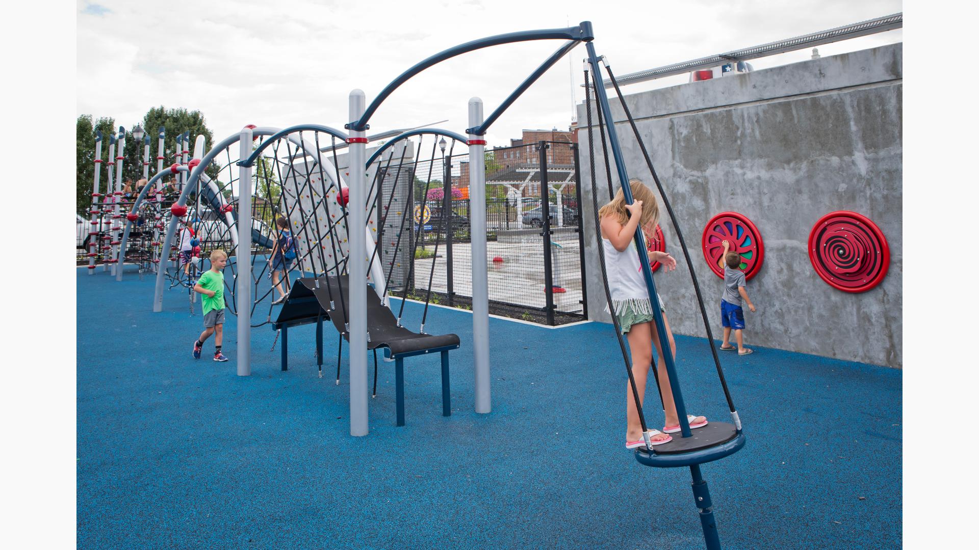 Children playing on motion net structures