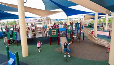 Morgan's Wonderland, San Antonio, TX.  A pirate-themed play area features two inclusive PlayBooster® play structures outfitted with soaring masts and sails.