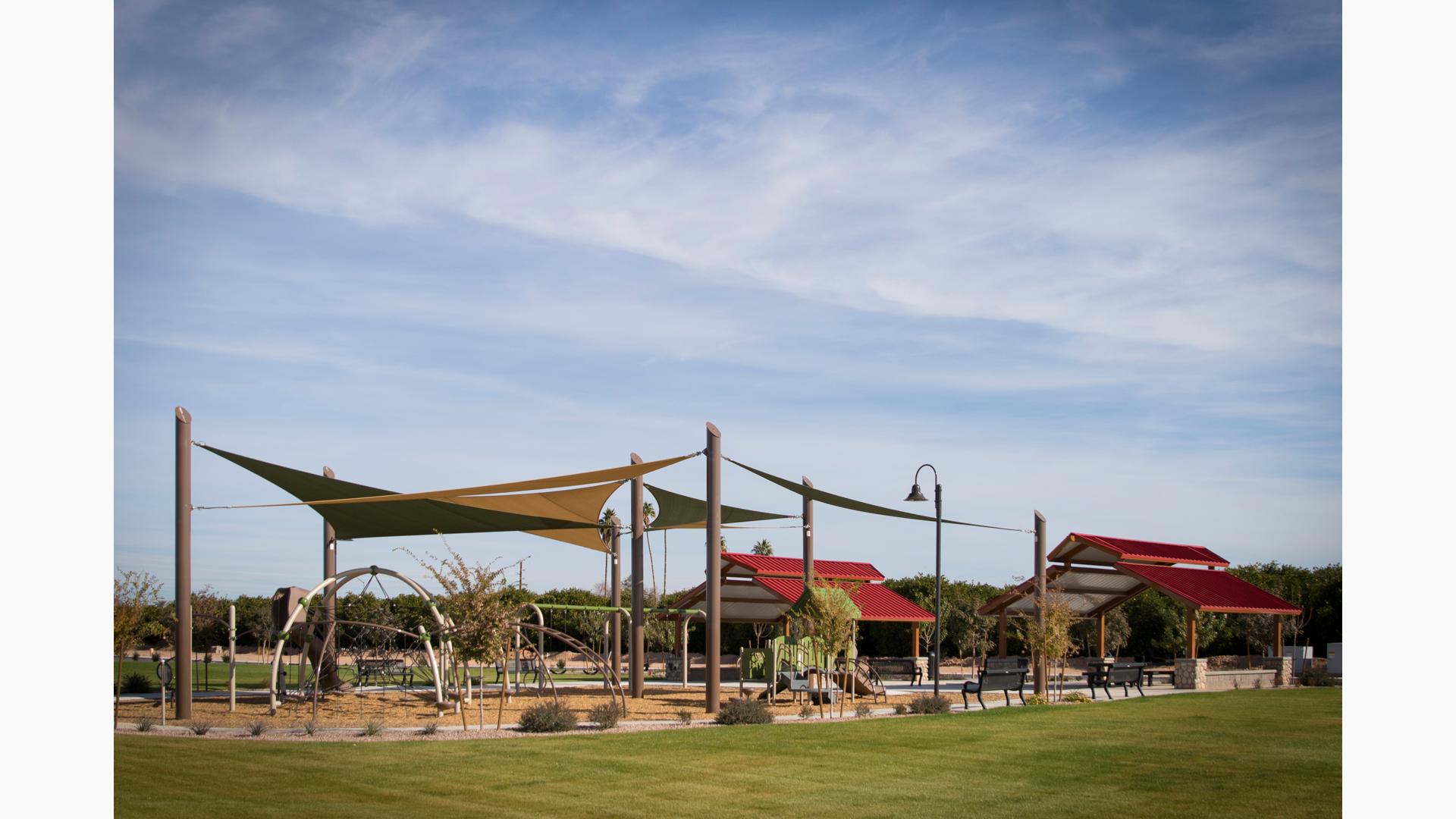 SkyWays shade covers Trovita Norte playground. A combination of Evos and PlayShapers play structures.