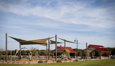 SkyWays shade covers Trovita Norte playground. A combination of Evos and PlayShapers play structures.