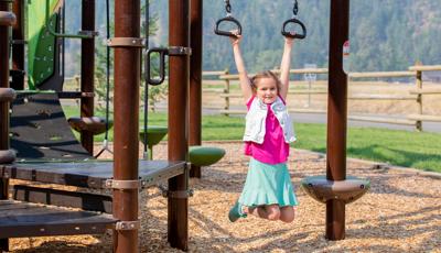 Girl hanging from Ring Bridge