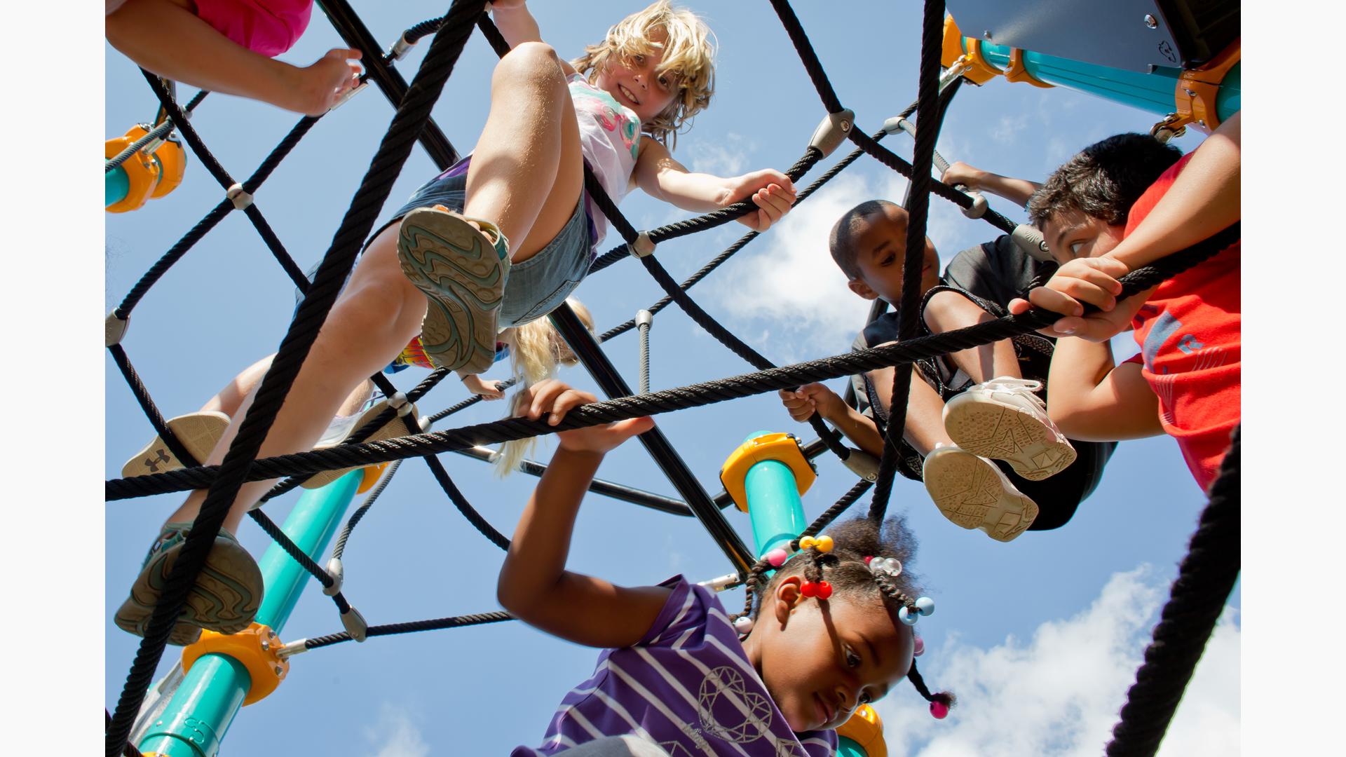 Kids playing in Netplex Climber