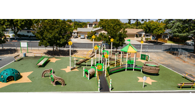 Playground at Ponderosa Elementary in Anaheim, CA. Green & yellow structure with star accents.  Inclusive play/Play Booster structure.