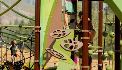 Girl on top of climber