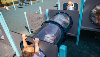 Children running through tunnels