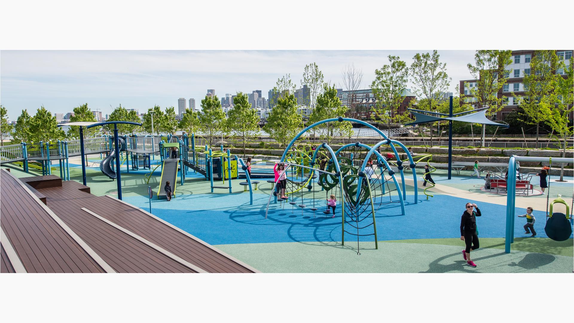 Mayor Thomas M. Menino Park, Charlestown, MA. The playground design was envisioned in the wake of the Boston Marathon bombings, the inclusive playground incorporated a ramped PlayBooster® play structure, embankment slides climbers, and an Evos® play system.