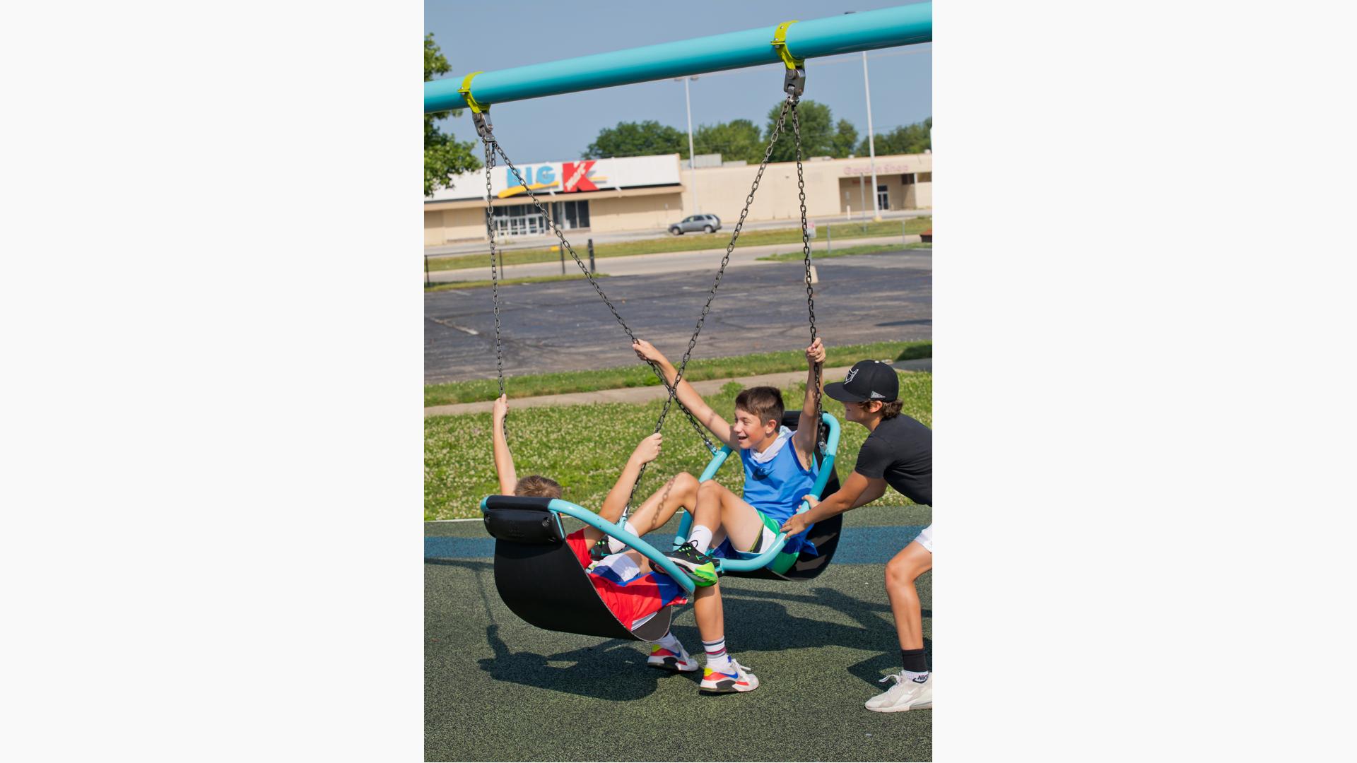 Kids using Friendship swing