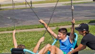 Kids using Friendship swing