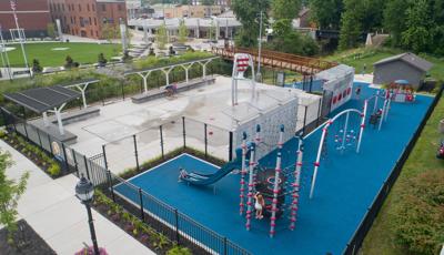 Prairie Creek park aerial - children climbing and riding slide.