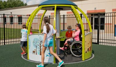 Children playing in We-Go-Round® with DigiFuse® Panels