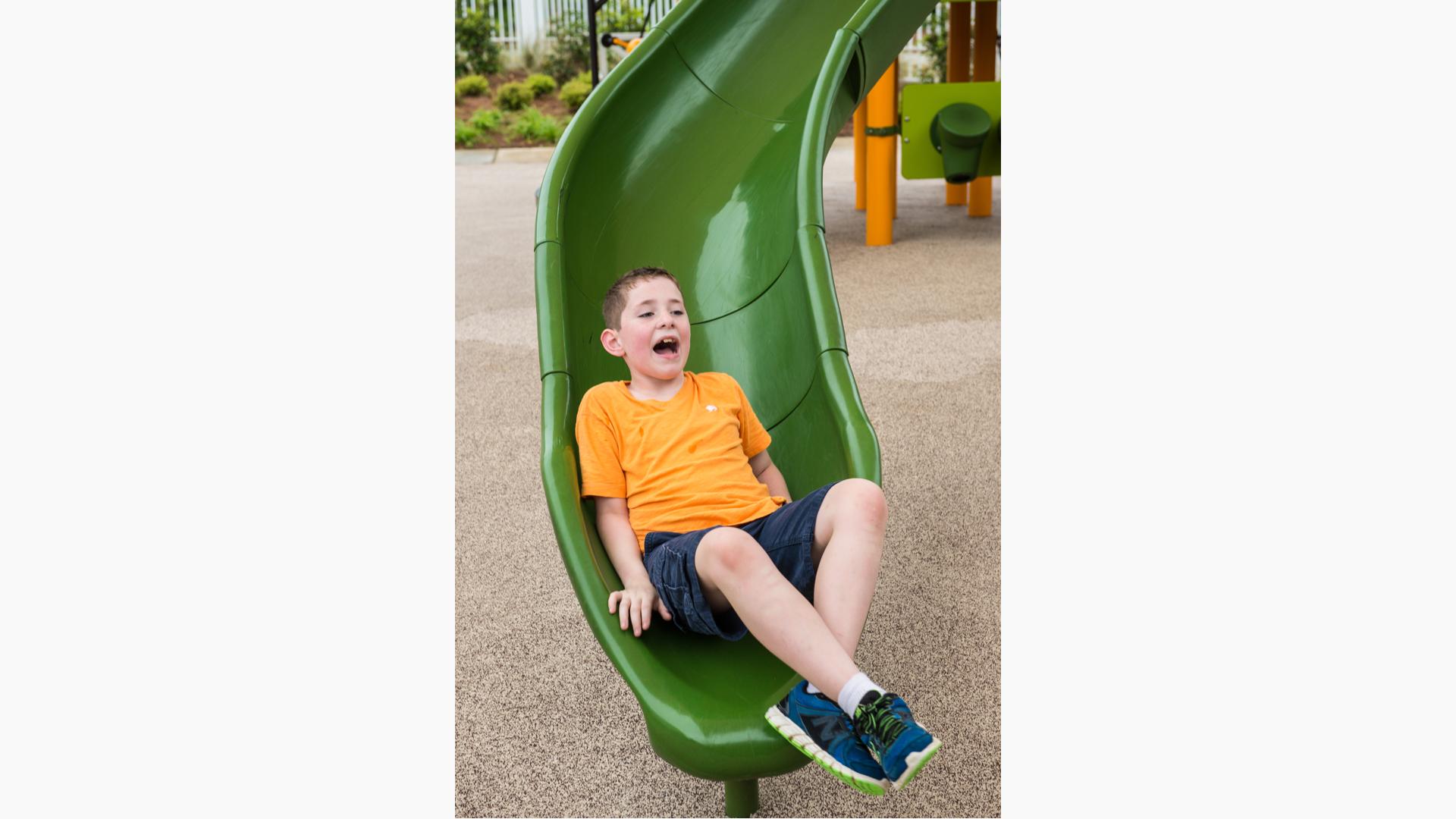 Outdoors and Recreation Clipart-child sliding down palyground slide light  color