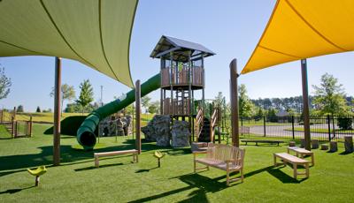 The PlayOdyssey® Tower at Discovery Park of America for age 5 to 12. Playground features a double bay ZipKrooz®, Rhapsody® Outdoor Musical Instruments, and SkyWays® shade.