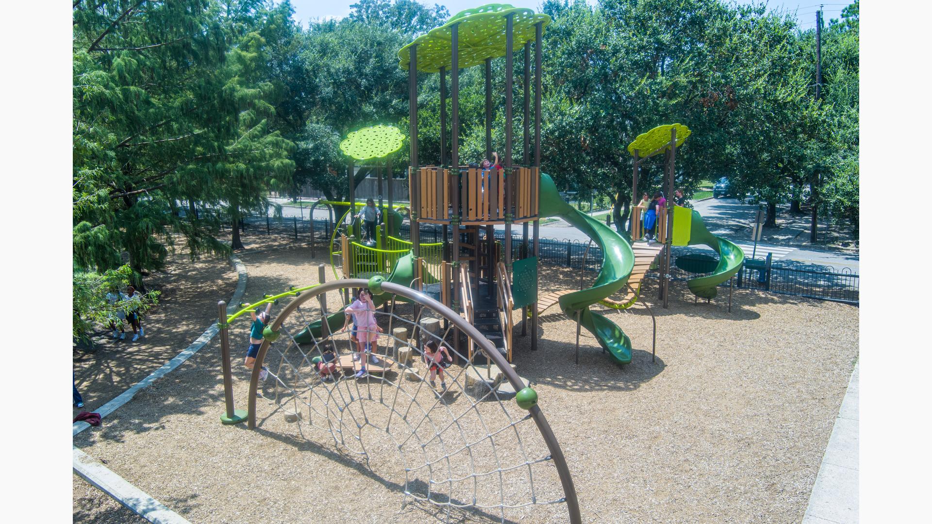 Children play on there school playground with a nature theme.