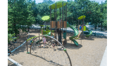 Children play on there school playground with a nature theme.