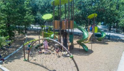 Children play on there school playground with a nature theme.