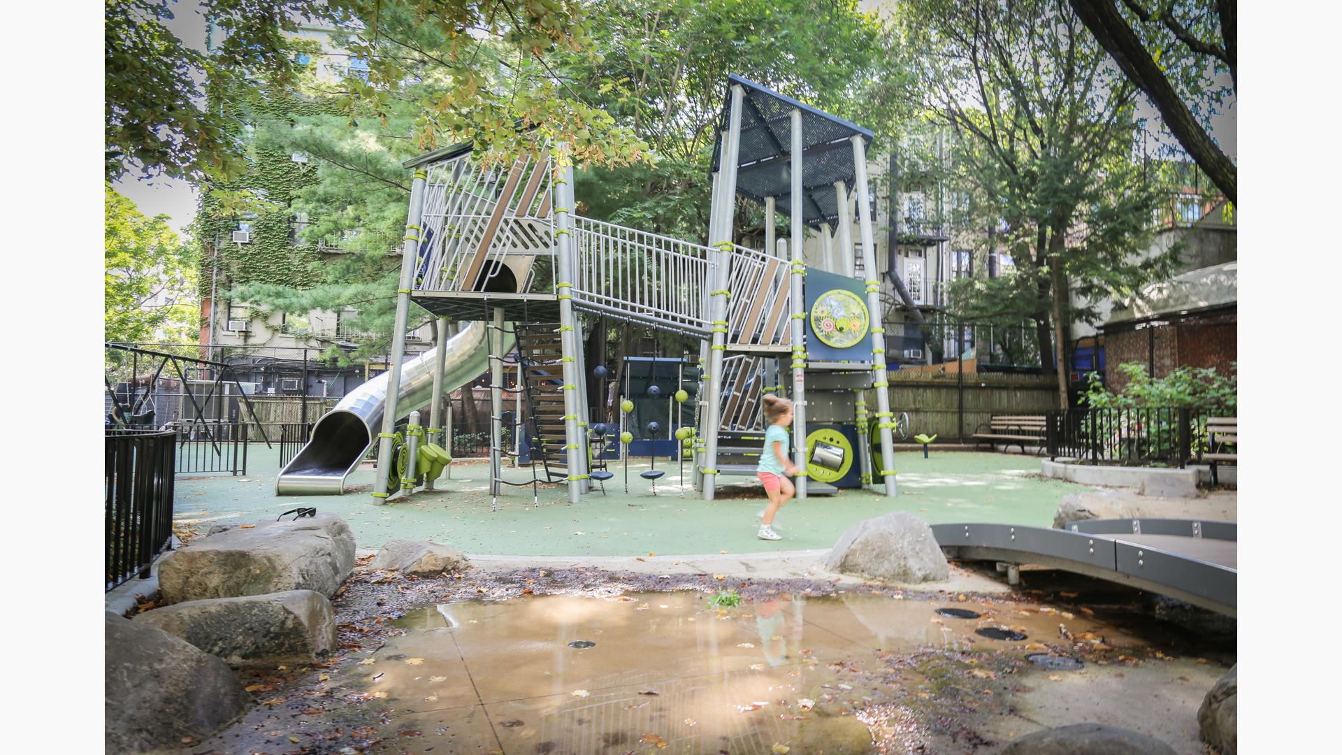 Girl runs across Joseph C. Sauer Park playscape