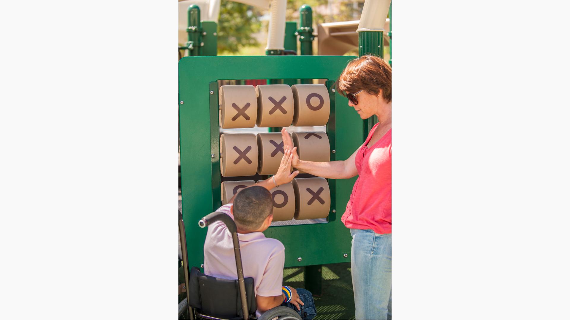 Woman and boy exchange high five