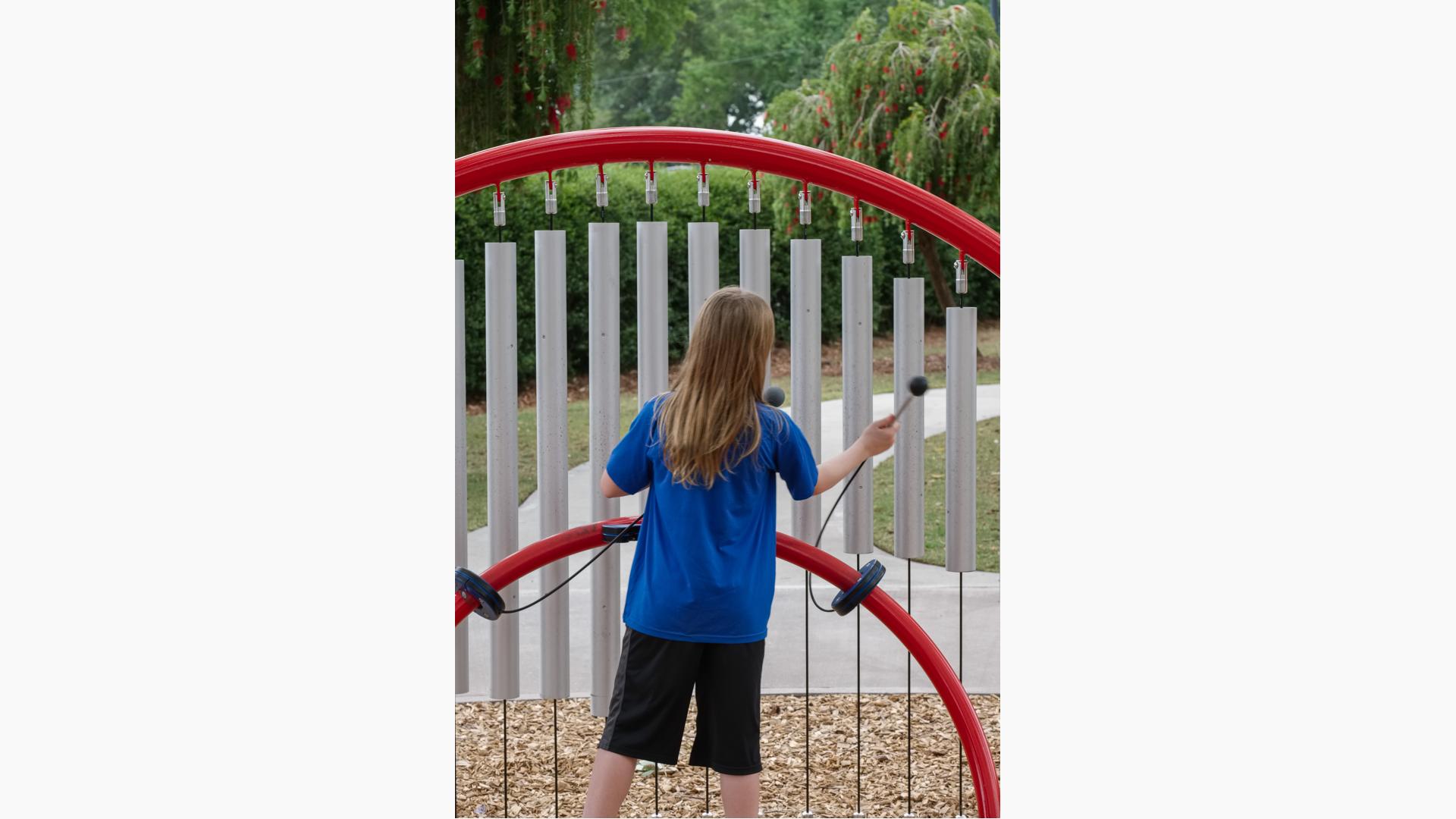 Girl playing on Rhapsody® Grandioso® Chimes