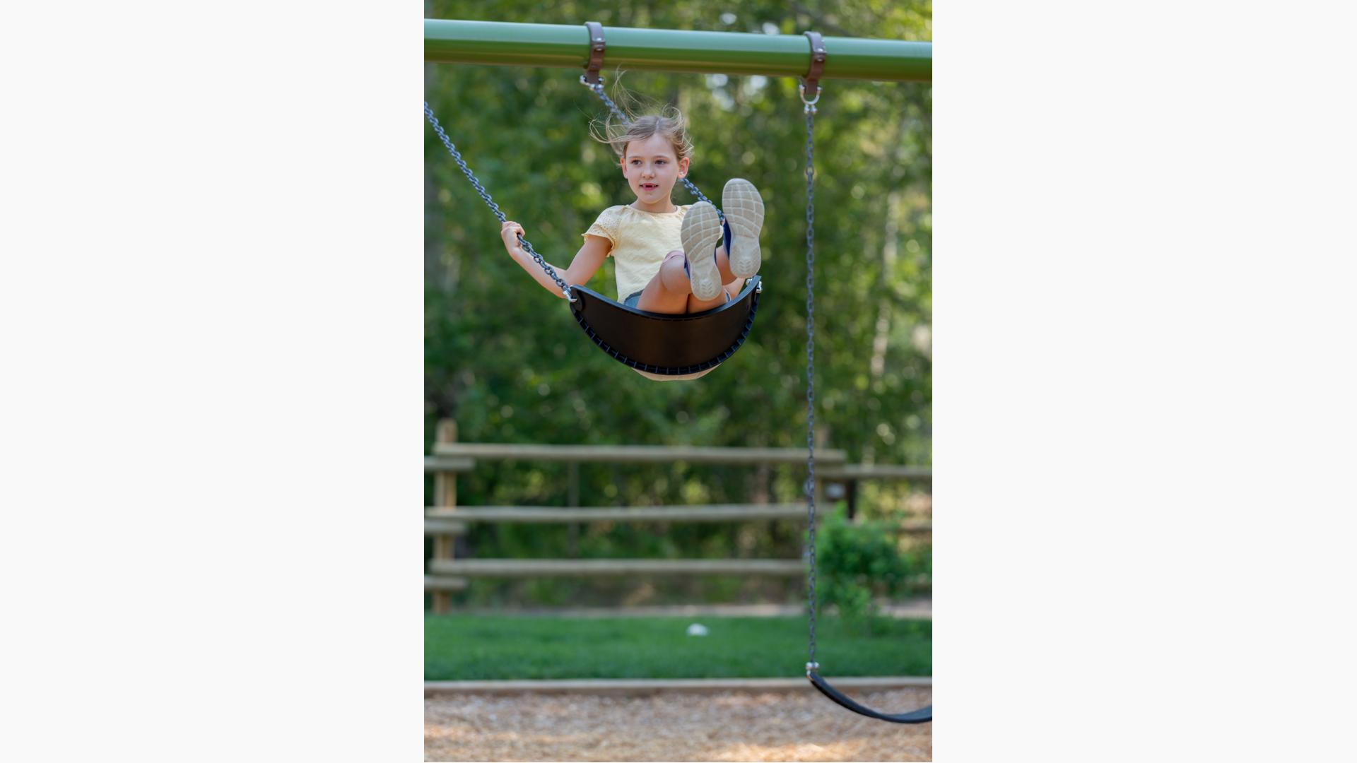 Girl riding swing