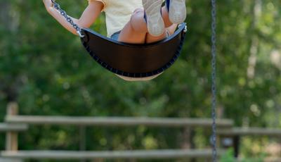 Girl riding swing