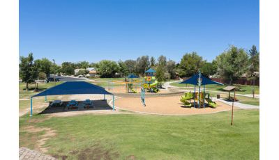 Nestled in a quaint neighborhood in Ridgecrest, CA, Pearson Park comes with two main structures for kids to play on. Along with swings and a Zipline, as well as picnic tables covered in SkyWays shade.