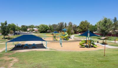 Nestled in a quaint neighborhood in Ridgecrest, CA, Pearson Park comes with two main structures for kids to play on. Along with swings and a Zipline, as well as picnic tables covered in SkyWays shade.