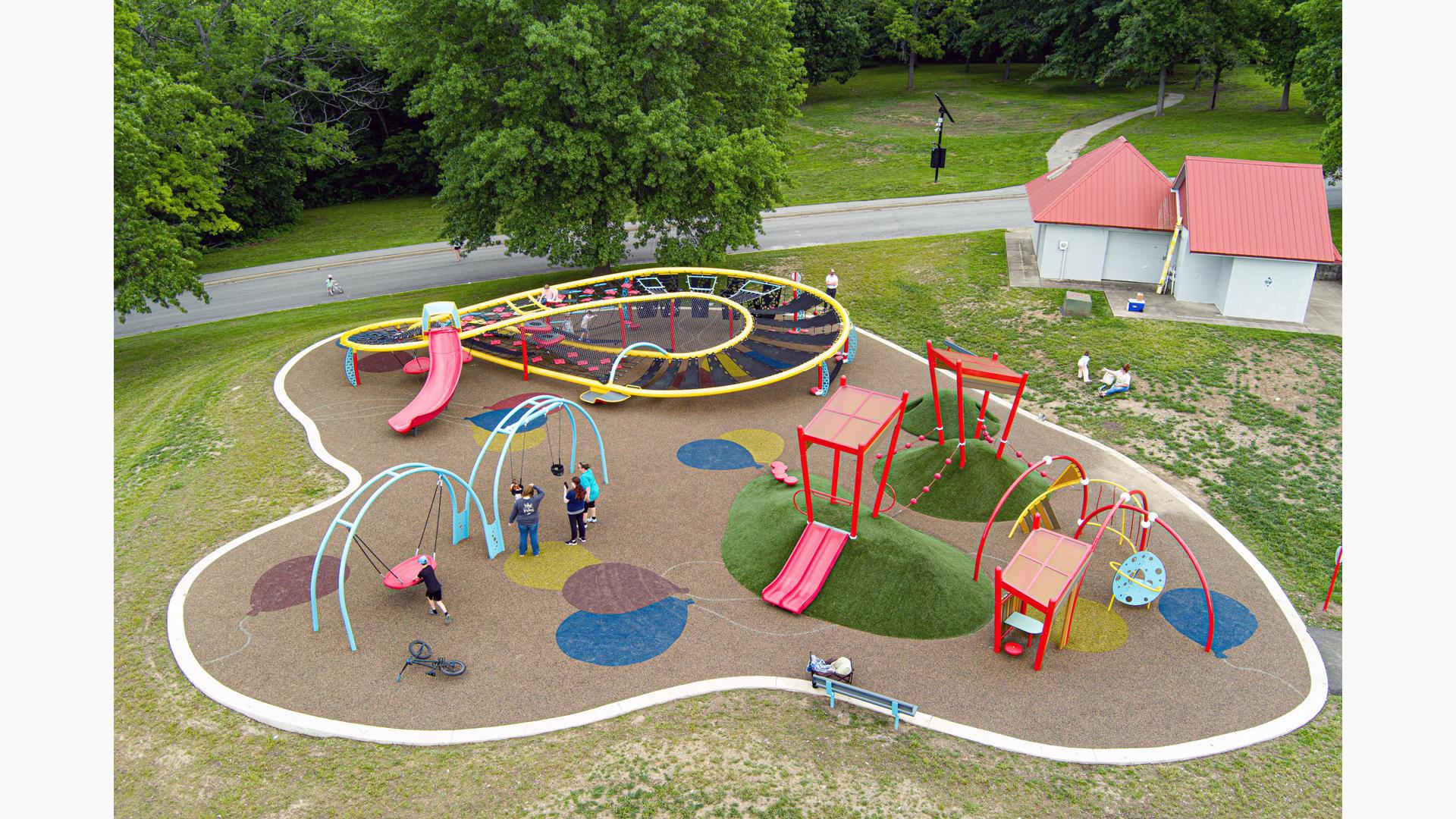 Elevated view of a park playground with unique figured at climbing sturcture.