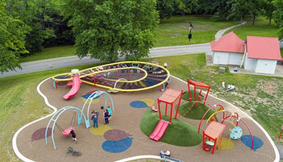 Elevated view of a park playground with unique figured at climbing sturcture.