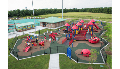 Olsen Park Wilmington, NC features an inclusive playground including a PlayBooster® play structure, accessible ramps, sensory-rich play panels, and many playground climbers and slides. Plus, a Weevos® play structure.