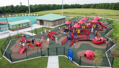 Olsen Park Wilmington, NC features an inclusive playground including a PlayBooster® play structure, accessible ramps, sensory-rich play panels, and many playground climbers and slides. Plus, a Weevos® play structure.
