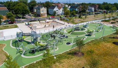 Elevated view of a large long rectangular play area with unique custom netted structures connecting all together for continuous play. 