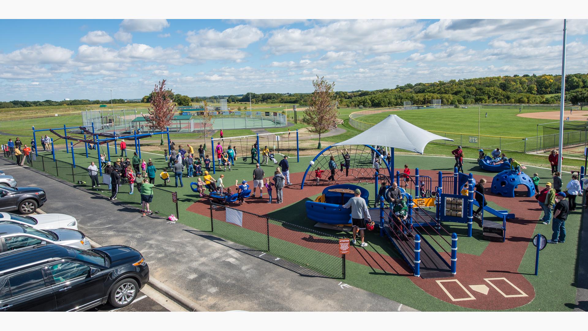 King Park Lakeville, MN includes a Miracle League baseball field, plus hosts a total of nine ball fields. The playground is baseball diamond-shaped, and it features an accessible PlayBooster® play structure, plus, there’s a ZipKrooz®