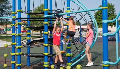 Kids playing on Netplex® play structure