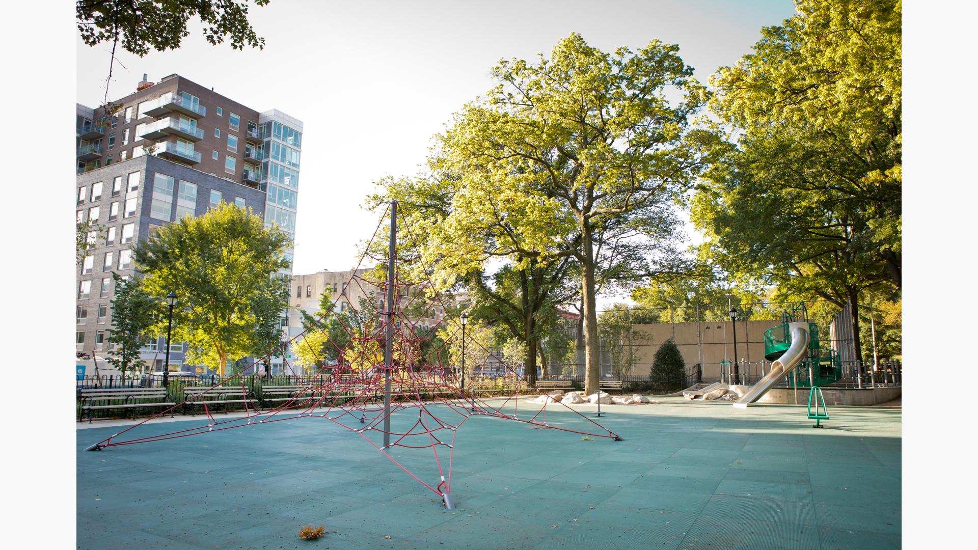 Morningside Park Playground 123, New York, NY. A double stainless steel slide, sensory play panels, and steps as well as a ramped entry, as well as Aeronet® climbers in addition to other playground nets.