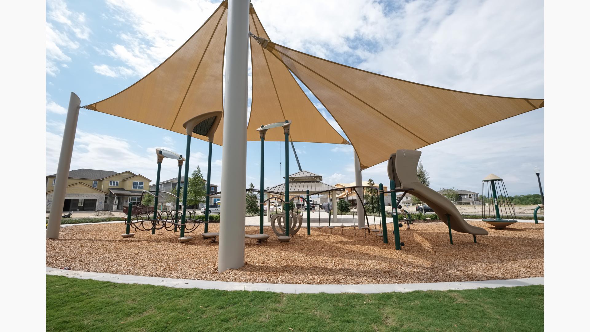 Shade sails covering playground.